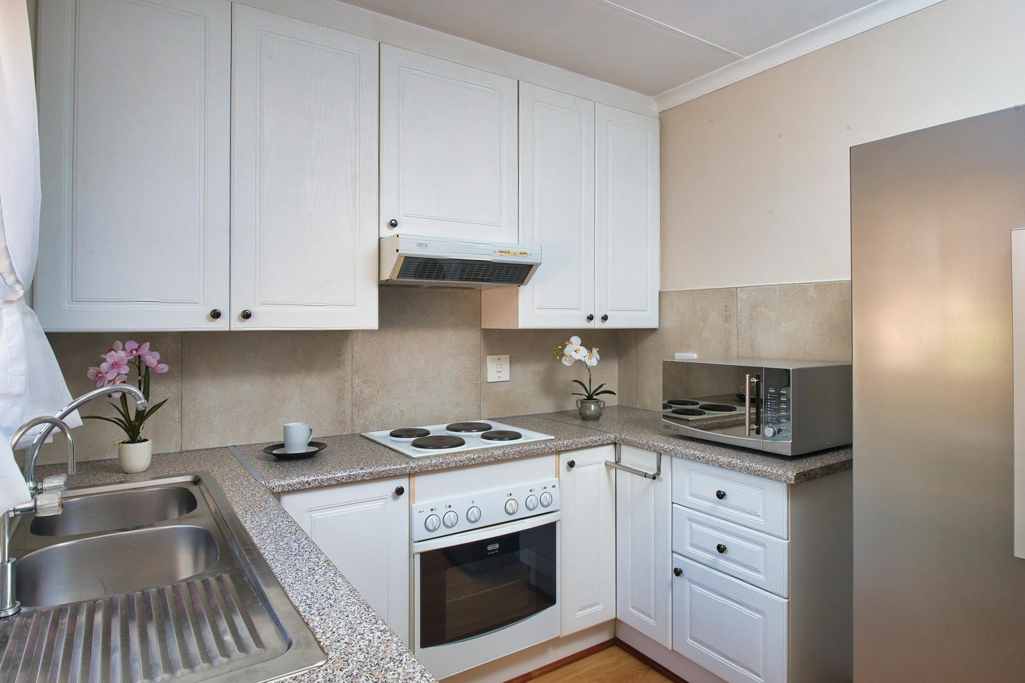 contemporary kitchen interior with white cabinets appliances